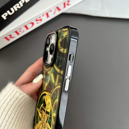 Stone Island logo iPhone case with black and yellow design held in hand on desk