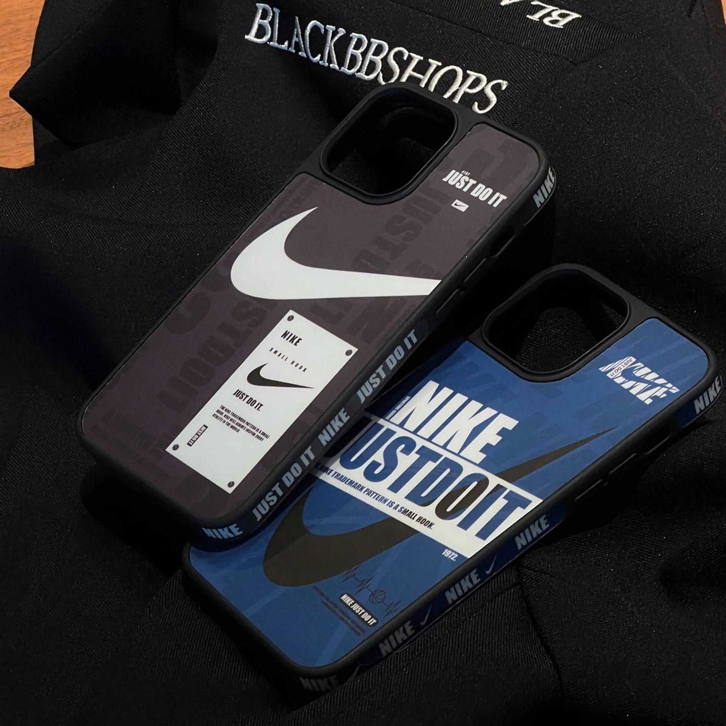 Nike sports iPhone cases with Just Do It design on black fabric background