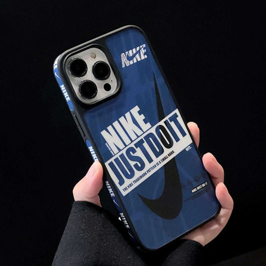 Hand holding iPhone with blue Nike Just Do It sports case, large swoosh logo, black background