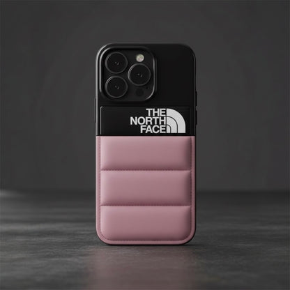 Pink padded The North Face phone case with black top, three camera lenses on gray background