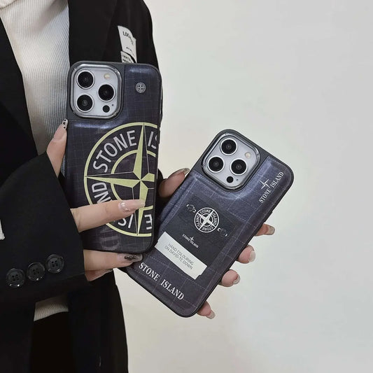 Stone Island iPhone cases with logo design held by person in black blazer